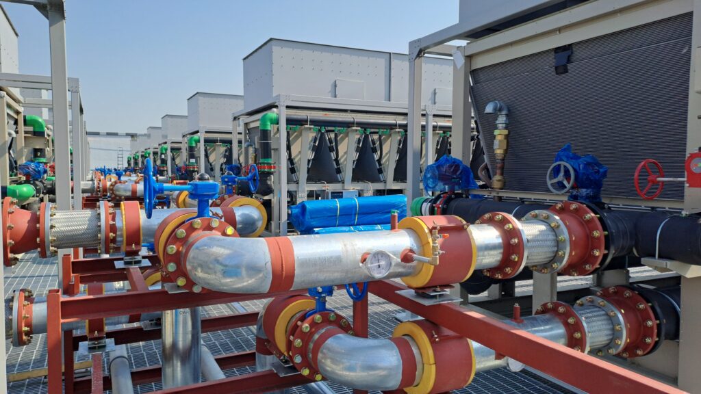 data center cooling solutions industrial cooling system and piping network on the rooftop of a modern data center under construction