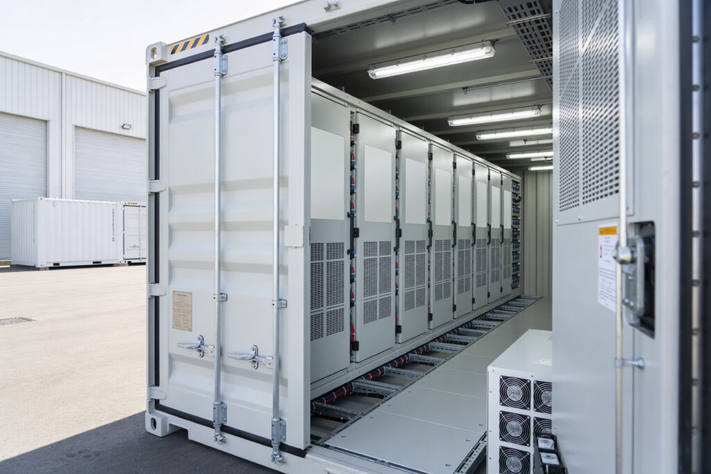 Data Center Cooling Solutions A portable data center solution featuring rows of server racks and integrated cooling units within a modified shipping container, ready for deployment